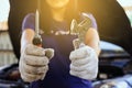 Hand mechanic engineer fixing,Car technician holding the screwdriver and spanner,concept car maintenance