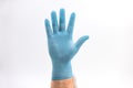 Hand with medical blue latex protective gloves on white background Royalty Free Stock Photo