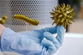 Hand in a medical glove holds caronavirus for research in the laboratory, concept. Search for a flu vaccine Royalty Free Stock Photo