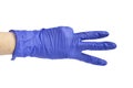 Hand in a medical glove shows three fingers Royalty Free Stock Photo
