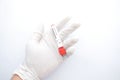 hand in medical gloves holding blood test tube on white background Royalty Free Stock Photo