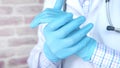hand in medical gloves showing trust and helpfulness