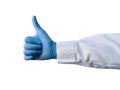 Hand of a medical worker shows thumb up on white isolated background. Hand gestures. Close-up Of A Hand Showing Thumb Up