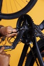 Hand mending bike with multipurpose tool Royalty Free Stock Photo