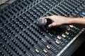 Hand with micro phone on a sound mixer Royalty Free Stock Photo