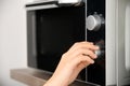 Hand and microwave Royalty Free Stock Photo