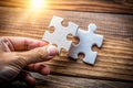 Hand with Missing Jigsaw Puzzle Piece - Business Concept Image for Completing the Final Puzzle Piece