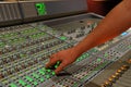 Hand on mixing console