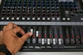 Hand on a Mixing Desk with vintage picture style, Music equipment in training room