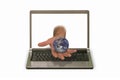 Hand with model of the planet reaching out of laptop display Royalty Free Stock Photo