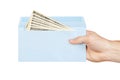 Hand and money in blue envelope Royalty Free Stock Photo