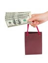 Hand with money shopping bag