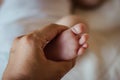hand of mother holding foot of newborn Royalty Free Stock Photo