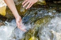Hand is in a mountain river stream Royalty Free Stock Photo