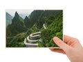 Hand and Mountains road in Tianmenshan nature park - China my p Royalty Free Stock Photo