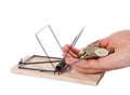 Hand and mousetrap with money Royalty Free Stock Photo