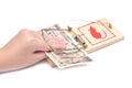 Hand and mousetrap with money Royalty Free Stock Photo