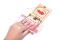 Hand and mousetrap with money Royalty Free Stock Photo