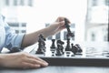 Hand move chess with strategy and tactic to win enemy, play battle on board game, business opportunity  competition strategic Royalty Free Stock Photo