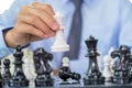 hand moves chess with strategy and tactic to win enemy, play battle on board game, business opportunity competition strategic Royalty Free Stock Photo