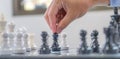 hand moves chess with strategy and tactic to win enemy, play battle on board game, business opportunity competition strategic Royalty Free Stock Photo