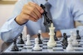 hand moves chess with strategy and tactic to win enemy, play battle on board game, business opportunity competition strategic Royalty Free Stock Photo