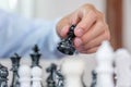 hand moves chess with strategy and tactic to win enemy, play battle on board game, business opportunity competition strategic