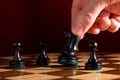 Hand moves knight on chess board Royalty Free Stock Photo