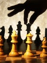 Hand moving chess piece Royalty Free Stock Photo
