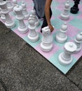 Hand moving knight on street chess board Royalty Free Stock Photo
