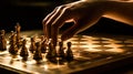 Hand moving strategic chess on golden chess board for business concept.