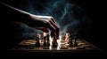 Hand moving strategic chess on smoke chess board for business concept