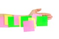 Hand and multicolored note paper Royalty Free Stock Photo