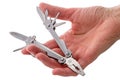 Hand with multifunction tool Royalty Free Stock Photo