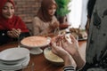 Hand muslim praying in dining room before eating