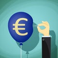 Hand with needle pierces the balloon. Euro currency symbol. Stoc