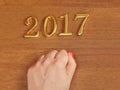 Hand and numbers 2017 on door - new year background Royalty Free Stock Photo