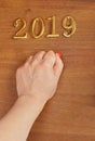 Hand and numbers 2019 on door - new year background Royalty Free Stock Photo