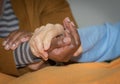 Hand of nurse holding a senior woman. Concept of helping hands, care for the elderly Royalty Free Stock Photo