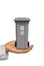 Hand offer gray trash can