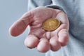 Hand offering Ethereum cryptocurrency coin Royalty Free Stock Photo