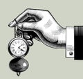 Hand with an old clock. Retro pocket watch