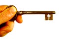 Hand And Old Key Royalty Free Stock Photo