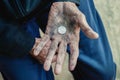 Hand old man begging for money because of the hunger vintage tone Royalty Free Stock Photo