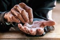 Hand old man begging for money because of the hunger vintage tone Royalty Free Stock Photo