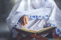 Hand of old muslim woman recites quran Royalty Free Stock Photo