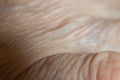 hand of old woman close up, macro photo, human skin as background