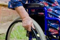 Hand of the old woman on an invalid armchair Royalty Free Stock Photo