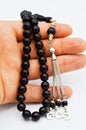 On hand oltu tespih tesbih, black stone, beads sequenced short rosary Royalty Free Stock Photo