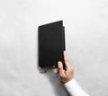 Hand open blank black book cover mock up template. Royalty Free Stock Photo